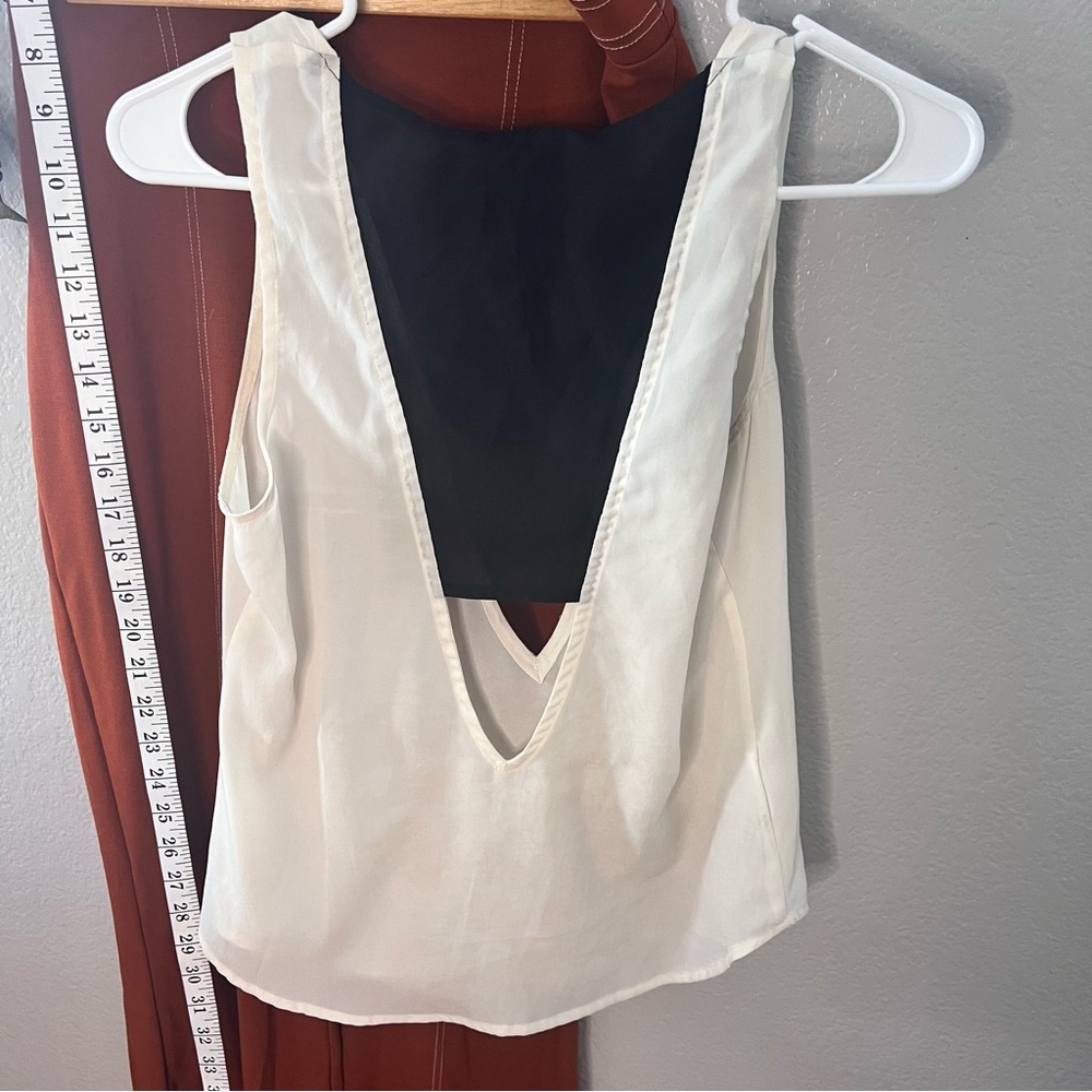 bcbGeneration Women's | black/white sleeveless chiffon blouse with cutou…